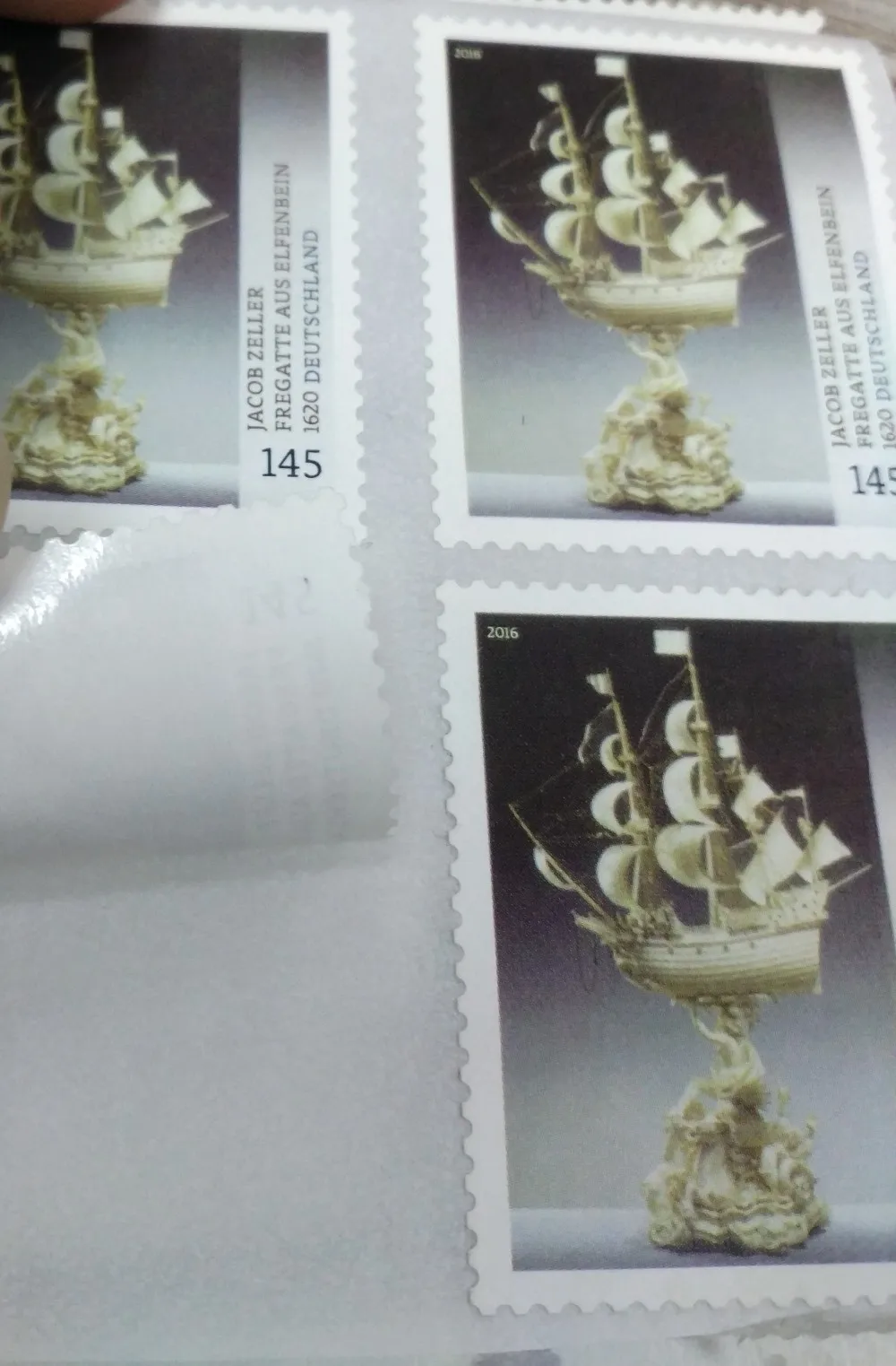 
official postage stamp with small holes with glue 