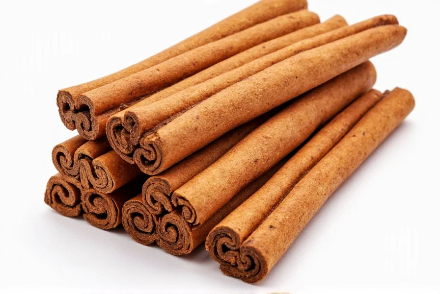 Close-up comparison of Mexican canela cinnamon sticks versus regular Cassia cinnamon sticks showing the thinner, multi-layered structure of canela