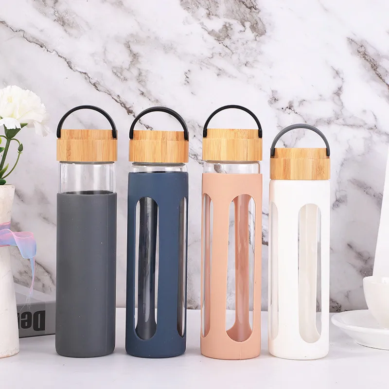 

BPA free 600ml Cosmetic Bamboo Lid Glass Water Pump Bottle with Glitter finishing Silicone Sleeve 34, Pantone color