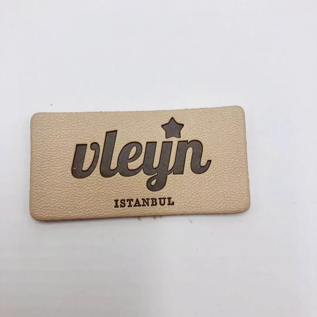 

High Quality Custom leather labels Debossed Logo leather patch label For Garment Jeans handbags clothing labels, Custom color