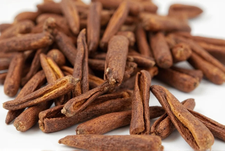 Clove oil extraction process showing steam distillation apparatus