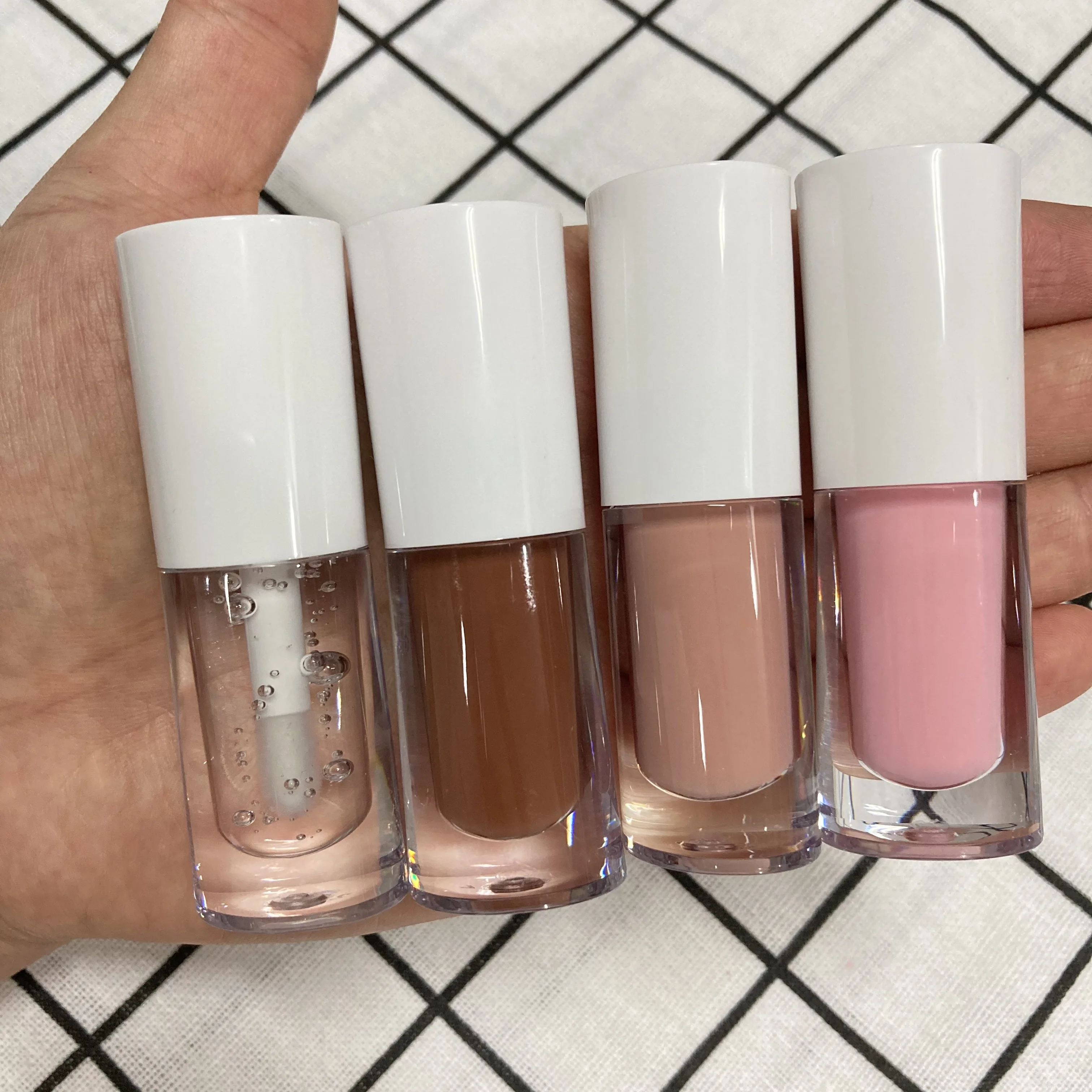 

New round lip gloss tubes with custom packaging vegan clear nude plumping lip gloss