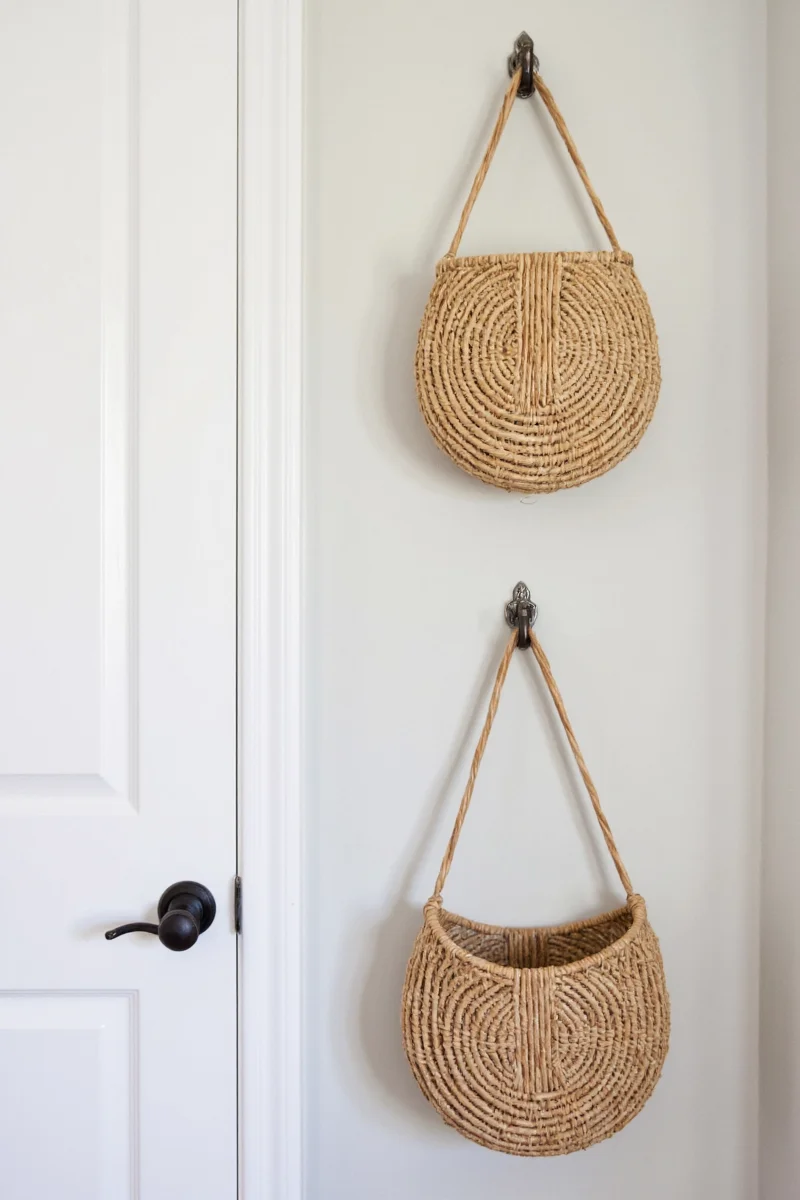 A boho-style bedroom with a bamboo basket holding flowers