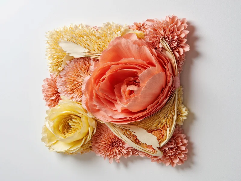 Layered paper sculpture with dimensional texture additions