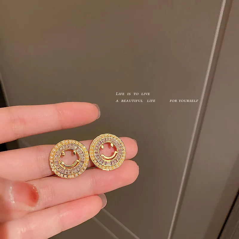 

fashion crystal smiling face stud earrings