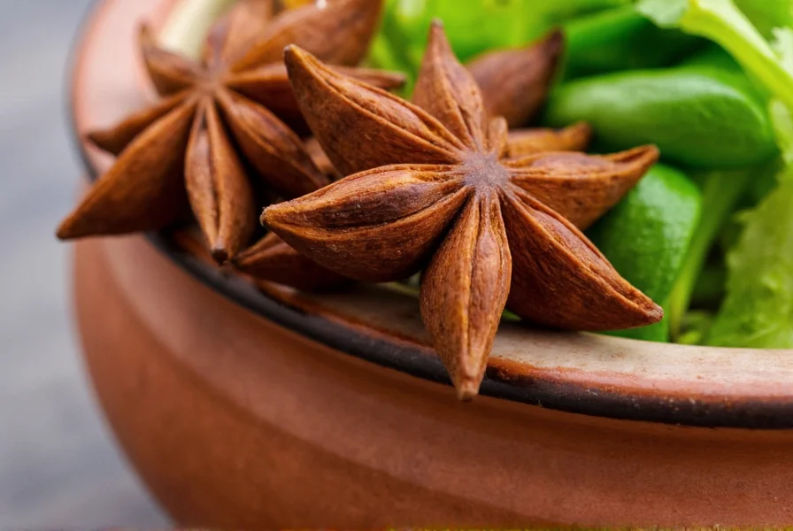 Close-up of star anise pods resting on traditional Vietnamese ceramic bowl with pho ingredients