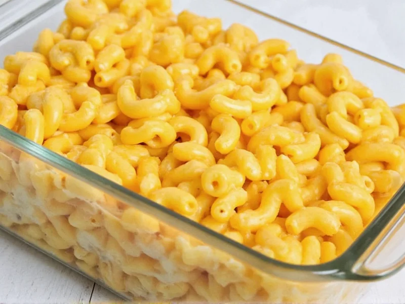 Homemade macaroni and cheese leftovers in glass container