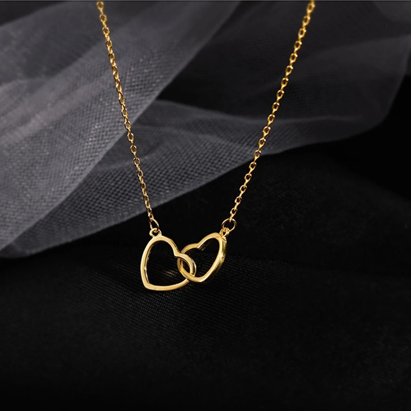 

Trendy women gold interlocking stainless steel heart necklace