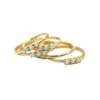 /product-detail/high-quality-18k-gold-plated-thin-band-delicate-minimal-white-fire-opal-three-stone-gold-ring-60699111392.html