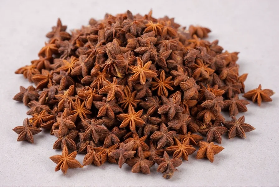 Star anise whole pods and ground spice on wooden background