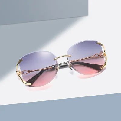 

Lmamba Metal Ocean Film proof new sun glasses Diamond rimless trimming Woman Shades Sunglasses 2021