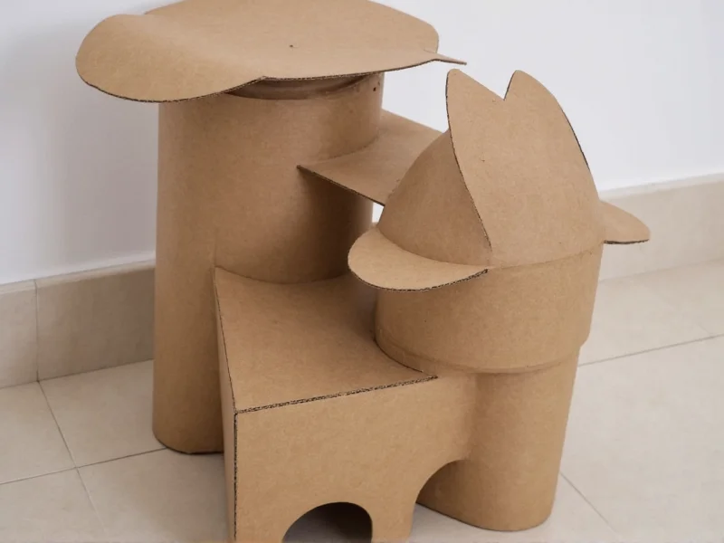 Cardboard cat scratcher tower made from recycled toilet paper rolls
