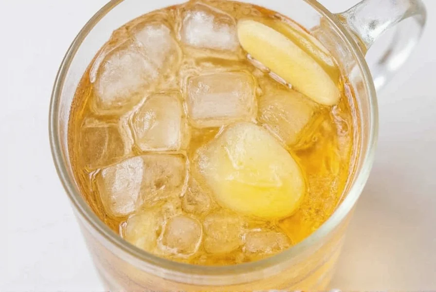 Close-up of fresh ginger root next to bottled ginger ale showing natural ingredients