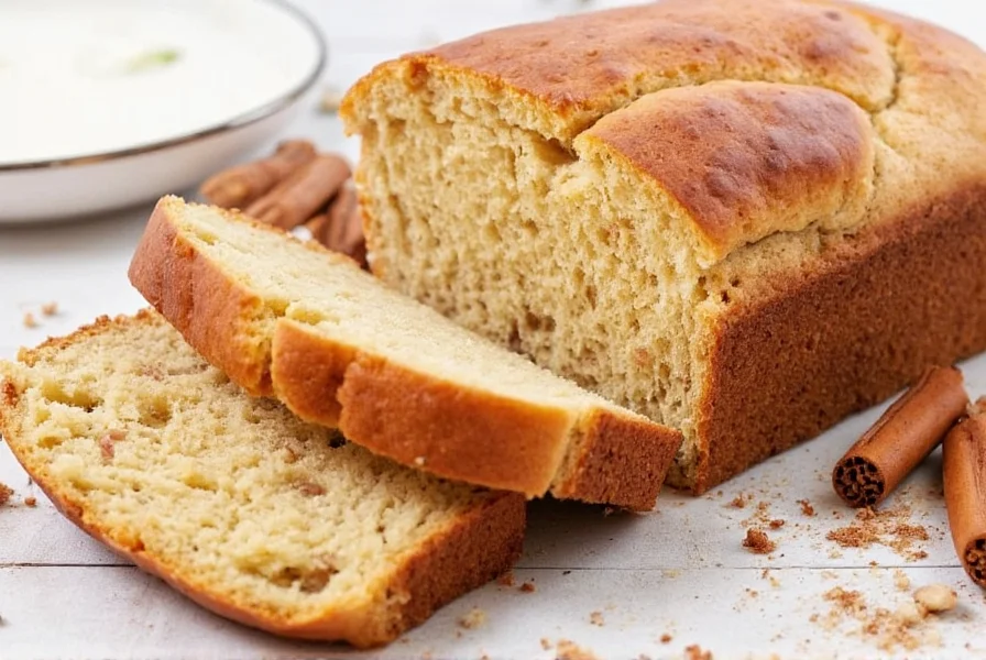 Sliced dollywood cinnamon bread served with coffee on rustic wooden table