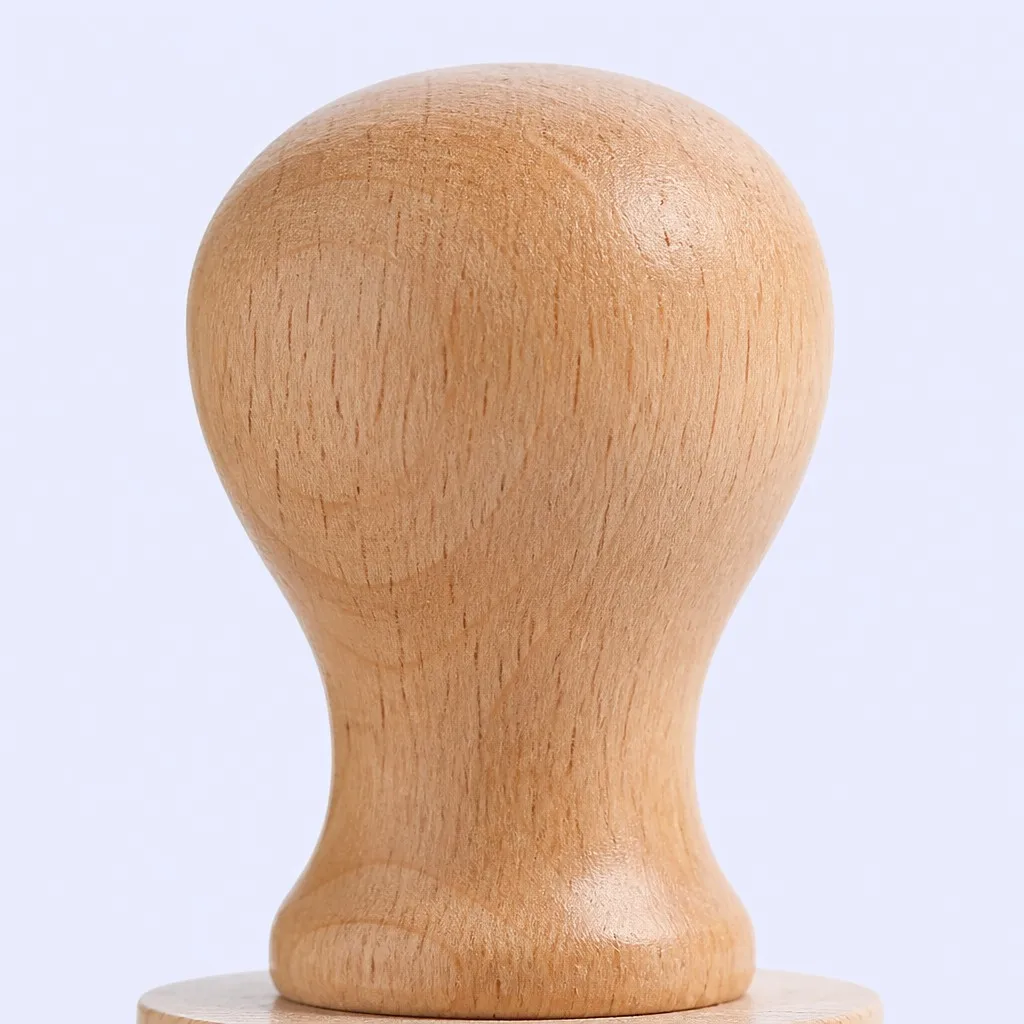 Close-up of a smooth natural wood handle on a rubber stamp