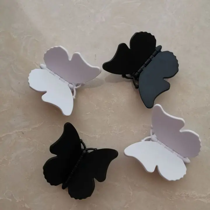 

Free Custom Butterfly Shaped Logo Socket Phone Holder Grip with Black White Color Phone Stand
