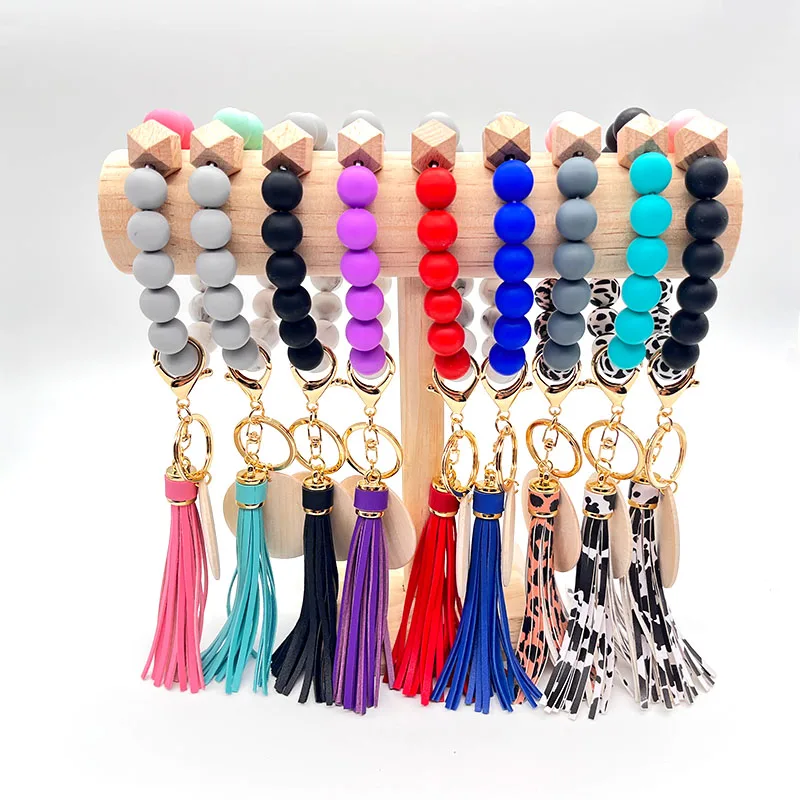 

10%OFF Customized Leather Tassel Keyring Elastic Wristlet Wood Silicone Bead Keychain Bracelet With Wooden Monogram Disc