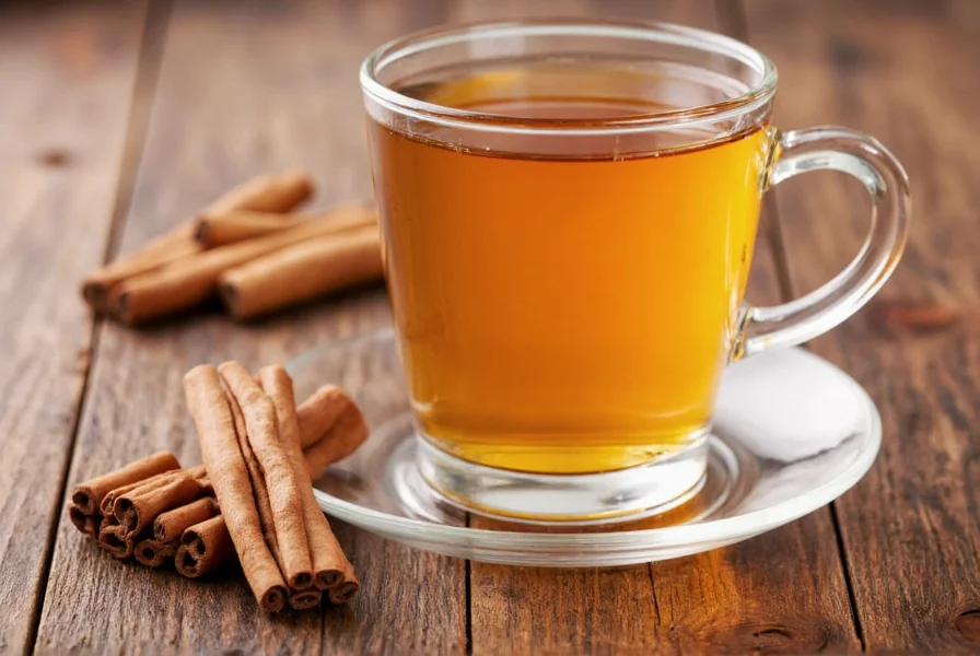 Close-up of Ceylon cinnamon sticks steeping in clear glass teapot with steam rising