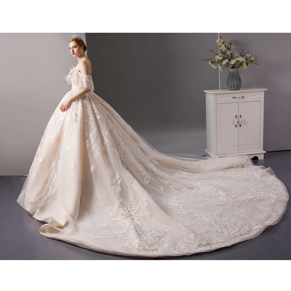 

SL6067 spaghetti strap wedding dress with puff sleeve backless lace applique champagne bridal dresses princess wedding ball gown