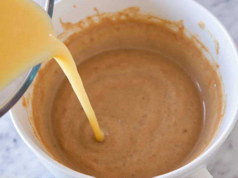 Milk and coffee poured into cake batter for flavor enhancement