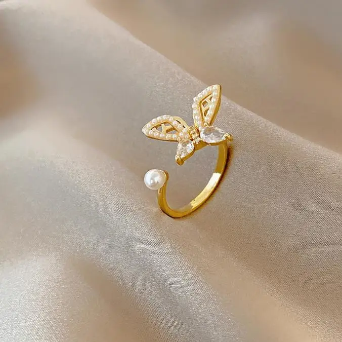 

Wholesale Gold Plated Hollow Metal Fashion Dainty Crystal Cubic Zircon Pearl Opening Adjustable Butterfly Ring For Women