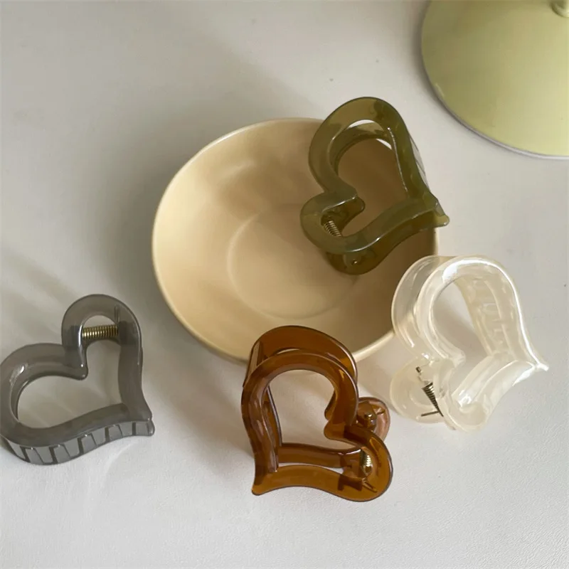 

Korean version of summer jelly color heart half tie girl medium size grab clip fresh sweet top clip new