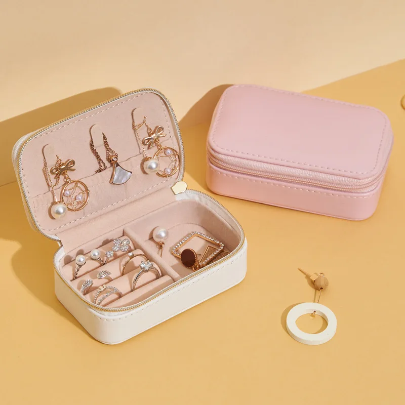 

amazon product Mini Jewelry Bag Portable Travel Jewelry Storage Box Leather Creative Jewelry Storage Box Small, White/pink