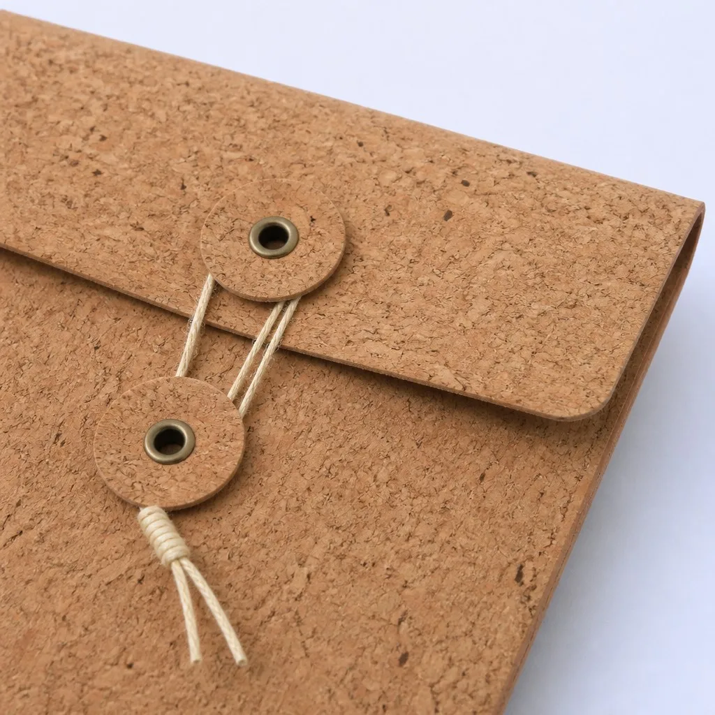 Button and string envelope tie closure