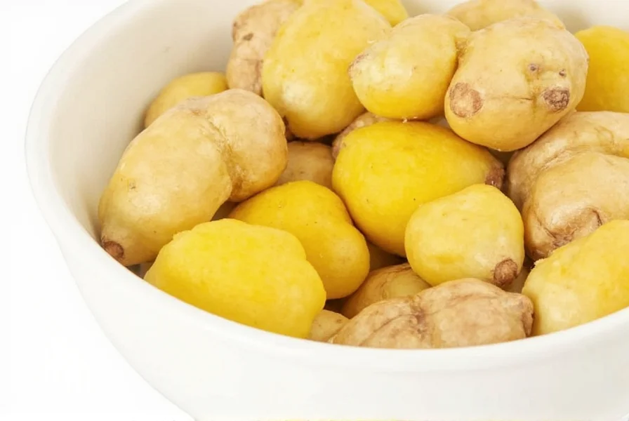 Fresh ginger rhizome showing individual fingers separated for cooking