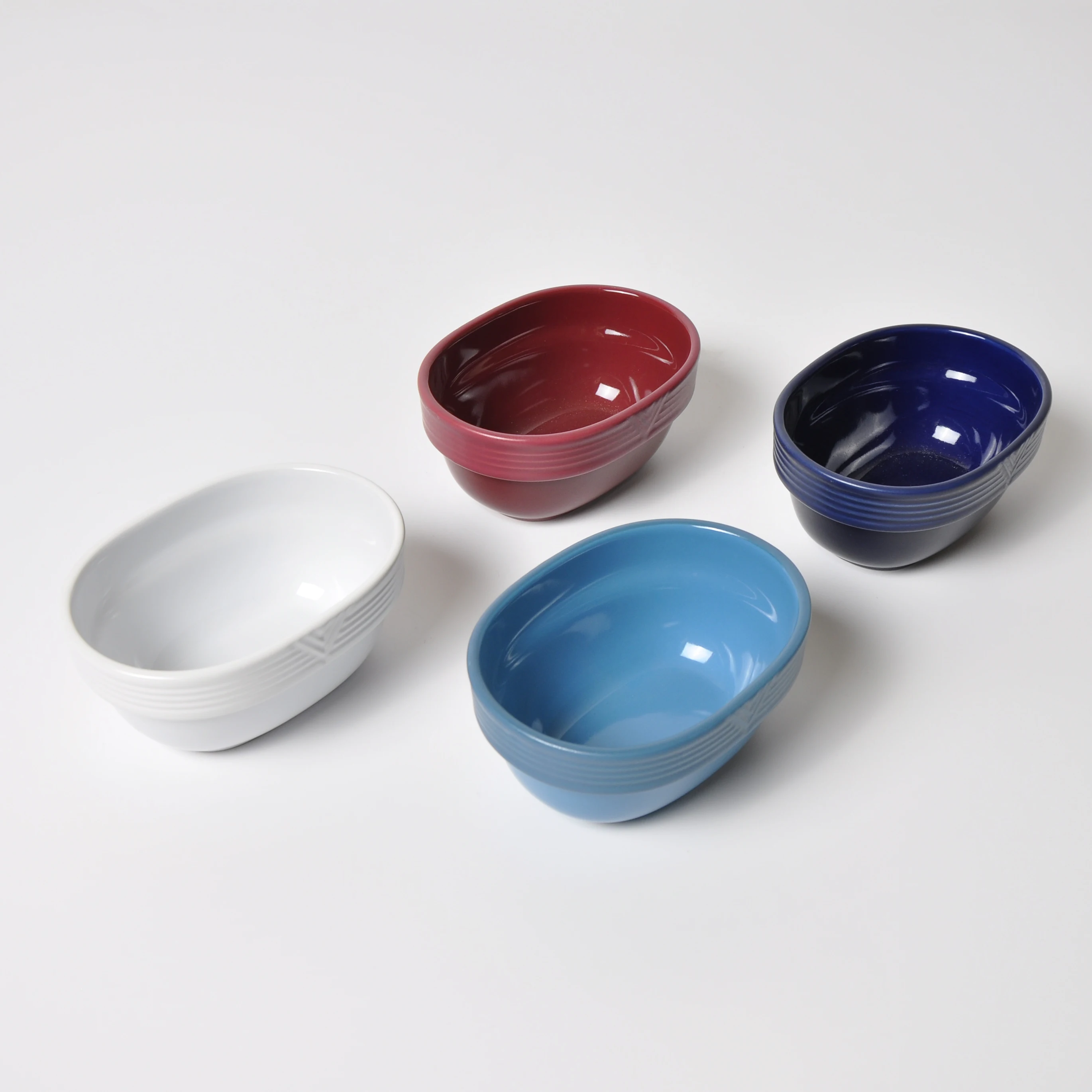 
New Design Colored Glaze Relievo Intagkio Oval Creamic Dinner Bowls Luxury Ceramic Bowl 