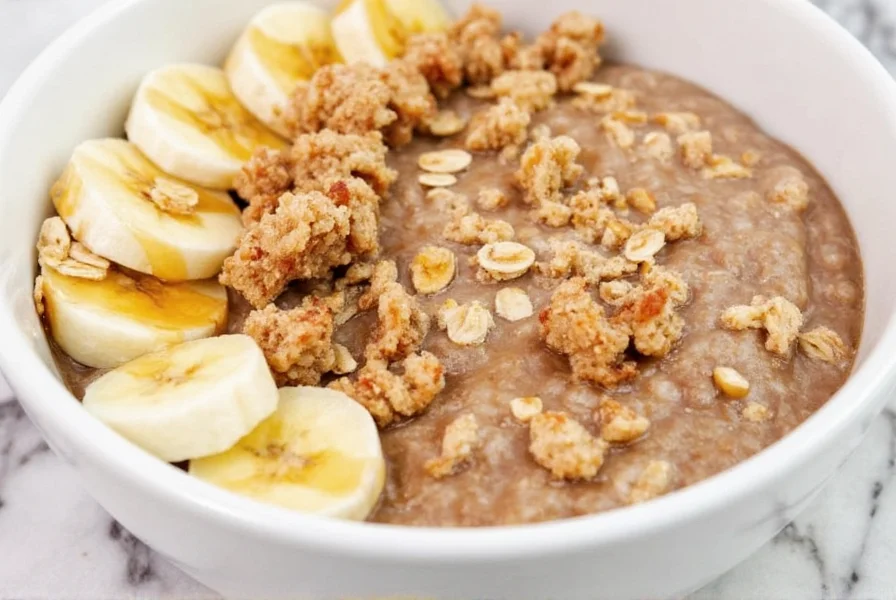 Cinnamon bun overnight oats in bowl with maple drizzle, toasted oats crumble, and fresh banana slices