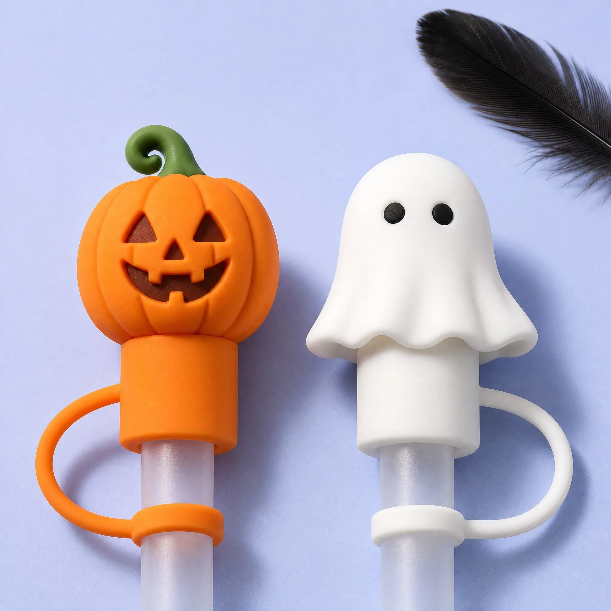 Pumpkin and Ghost Silicone Straw Caps Close-up with Black Feather