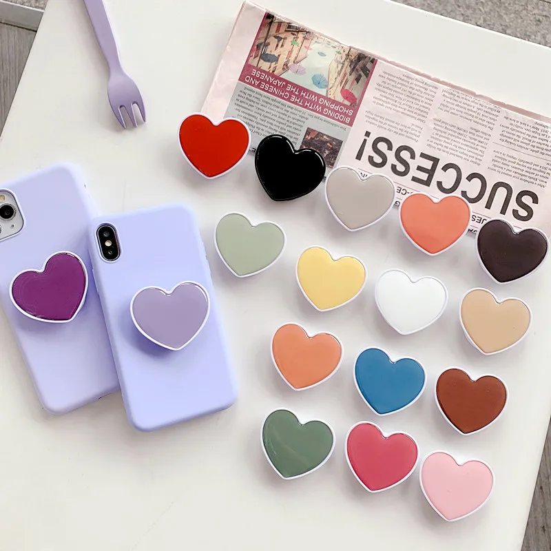 

New solid color heart-shaped epoxy resin mobile holder phone grip promotional gifts custom phone sockets with logo, White/black/custom