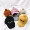 Trial wearing range of winter baseball caps for forest-colored children aged 3-7
