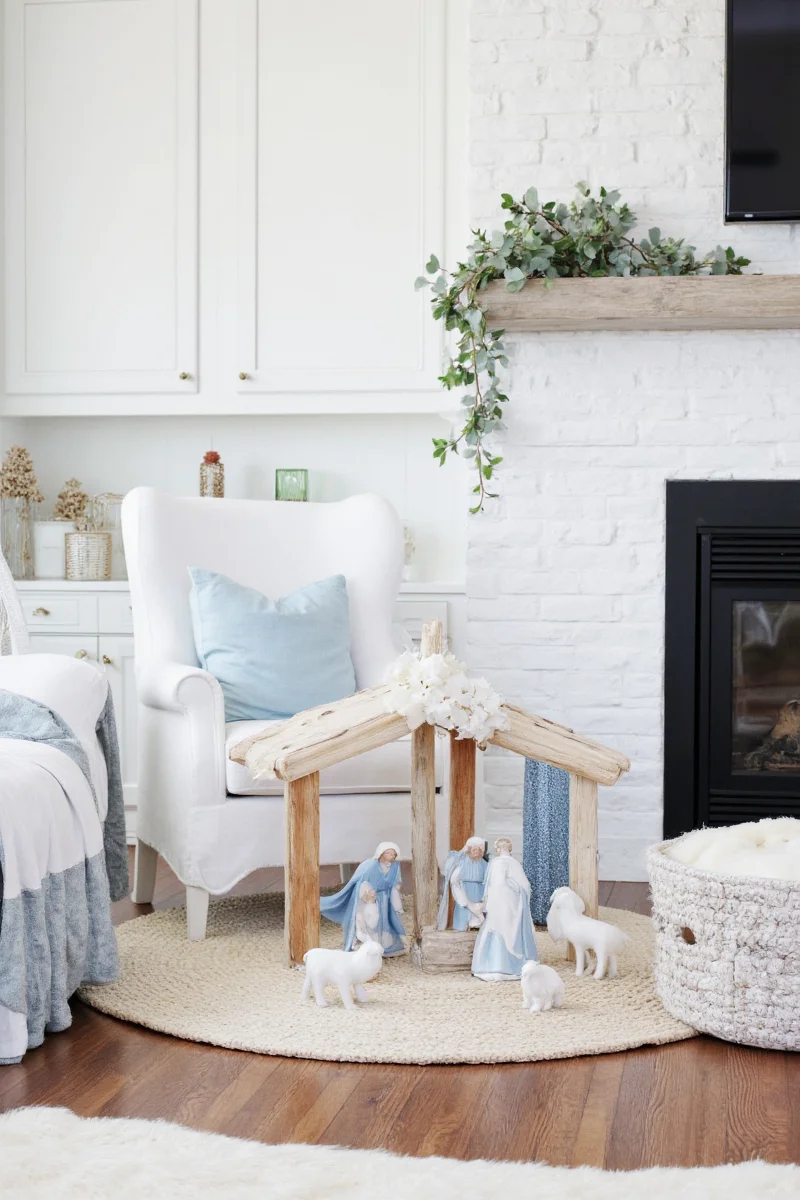 Blue and white nativity decorated with seasonal accents