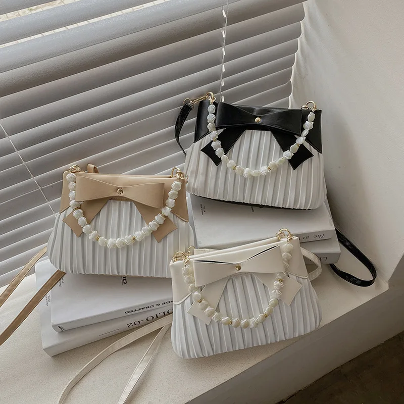 

2021 New PU material pearl bow pleated shell shoulder bag girls shopping small and lovely handbags, 3 colors