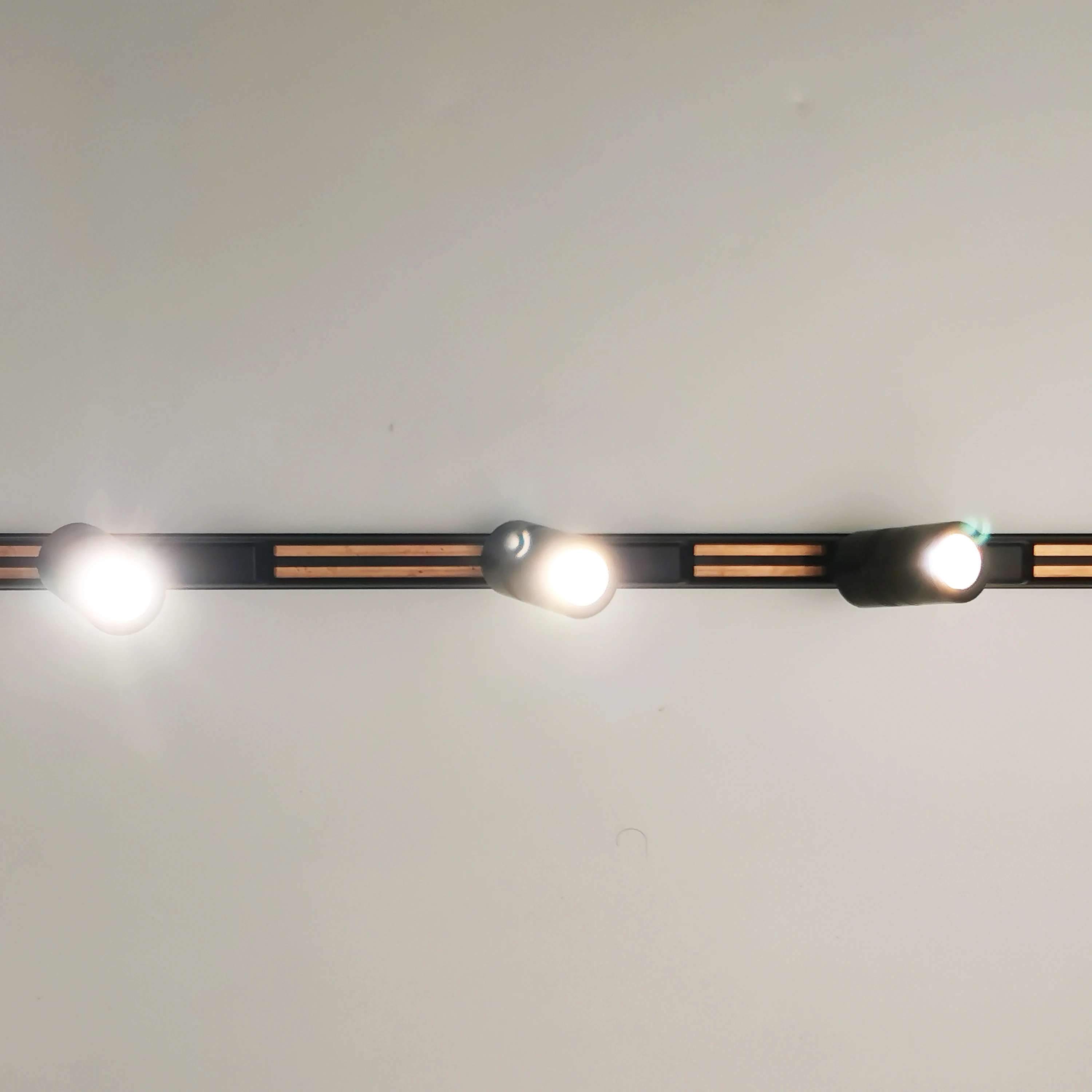 A rail track lighting system with led rail magnetic 3 pieces spot tracklights