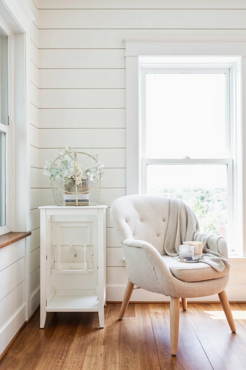 Kids' bedroom with knotty pine walls, bunk beds, and playful accents