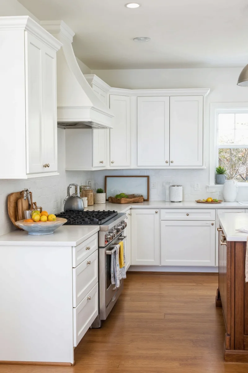Kitchen with colorful backsplash and White Dove cabinets