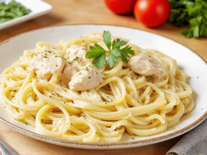 Homemade chicken alfredo with fresh parsley garnish