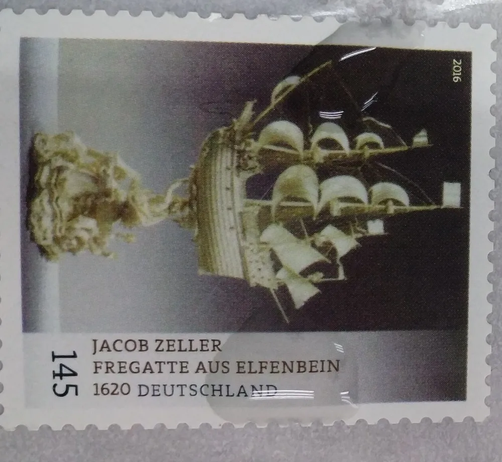 
official postage stamp with small holes with glue 