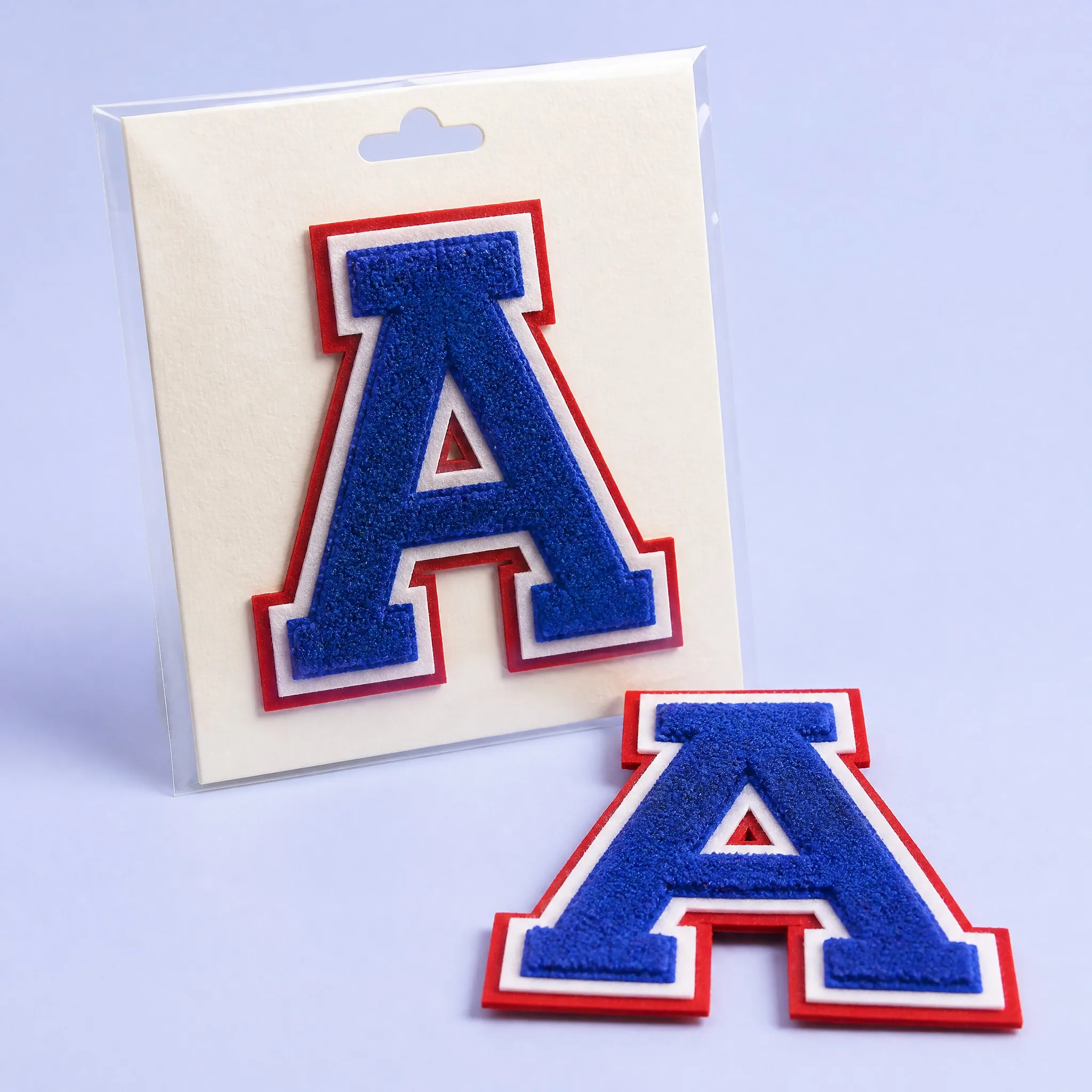 Royal Blue Chenille Varsity Letter A Patch with White and Red Dual Felt Borders Sealed in Clear Hanging Poly Bag