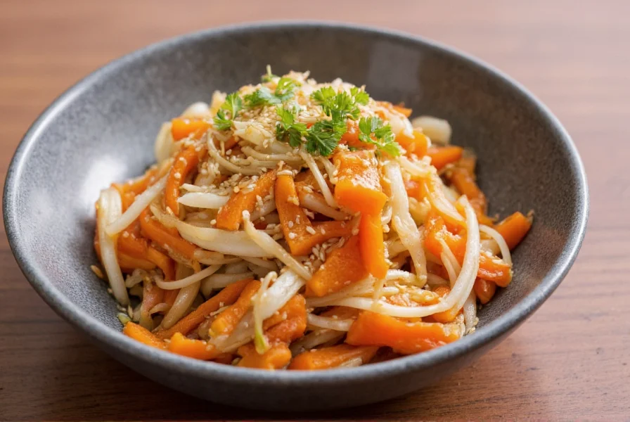 Kinpira Gobo dish showing stir-fried burdock root and carrots with sesame seeds