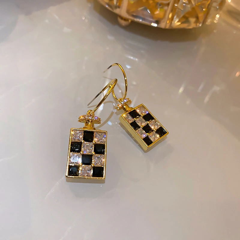 

black white drop hoop earrings bottle