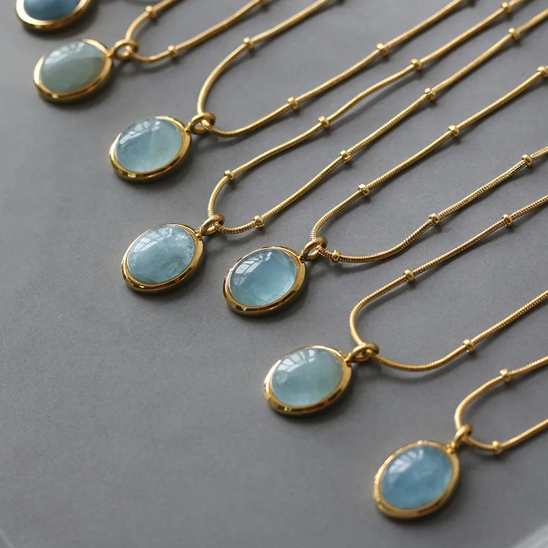 

Hot Selling INS New Design Oval Shaped Blue Aquamarine Pendant 18k Gold Plated Stainless Steel Chain Necklace For Women, Picture