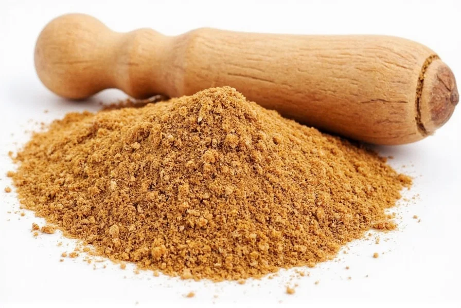 Cup of warm milk with ground nutmeg sprinkled on top