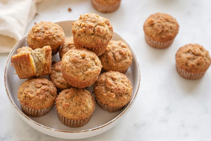 Cinnamon streusel muffins served with coffee on rustic wooden table