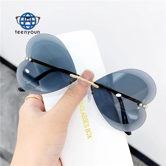 

Teenyoun Eyewear Cheap Butterfly Frameless Sun Glasses Colorful Lenses Shades Heart Shape Diamond Sunglasses 2023 New Women