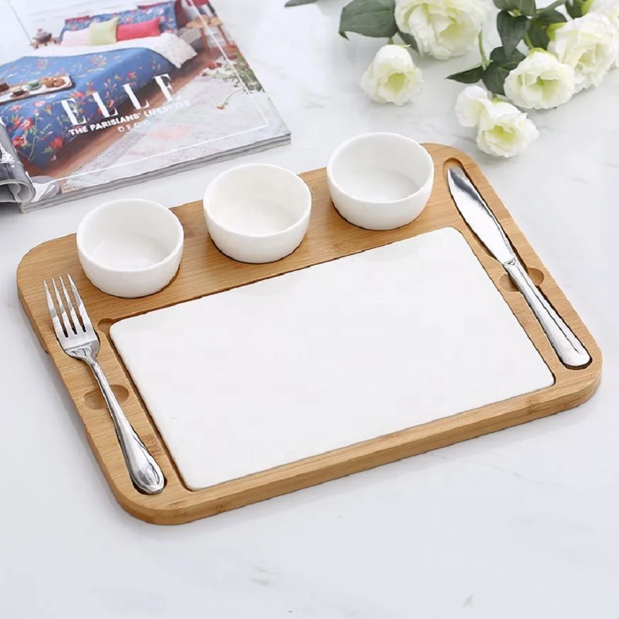 

Hot sale kitchen restaurant ceramic plate bowl stainless steel cutlery set with bamboo mat creative ceramic western plate