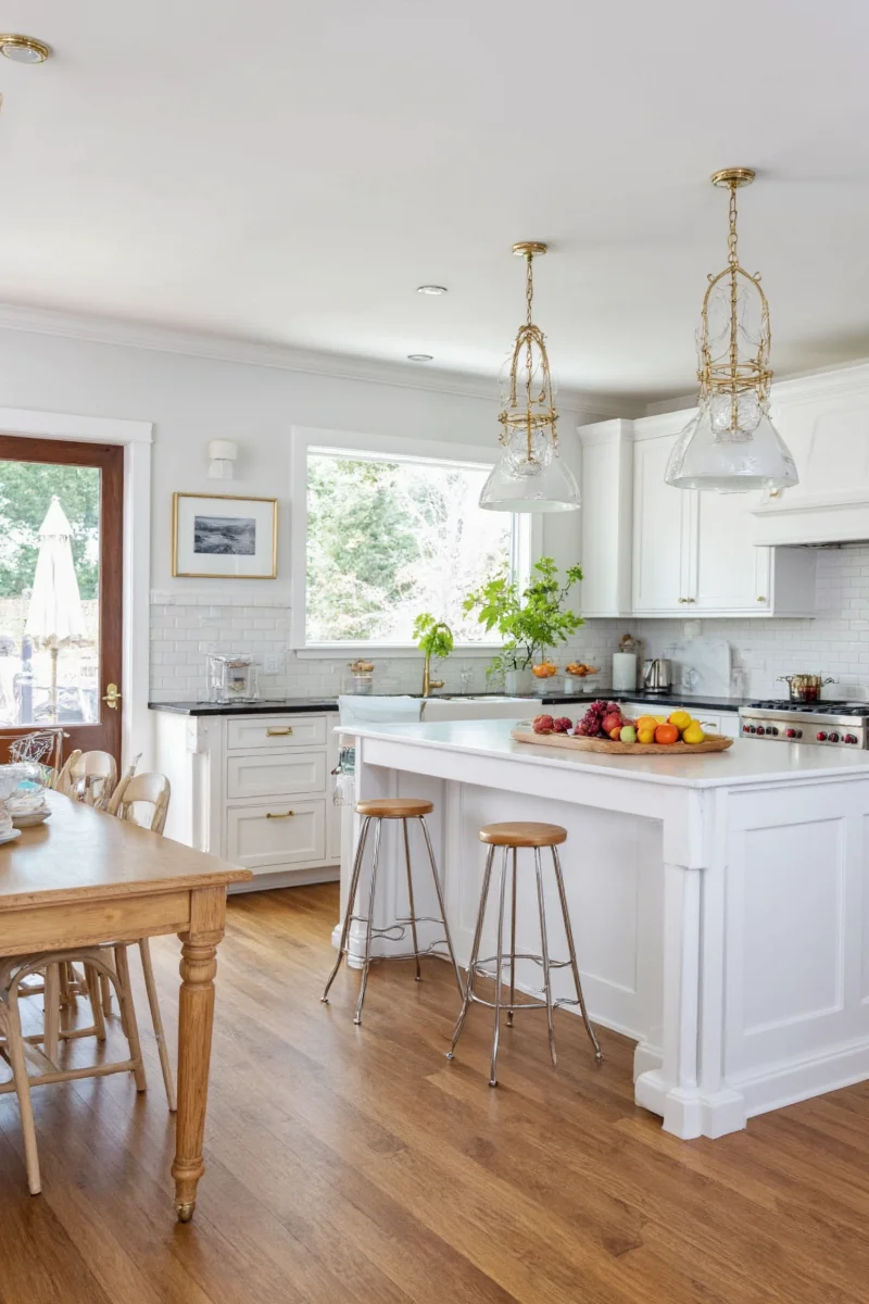 Kitchen island turned into party buffet with dishes and snacks